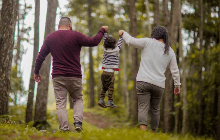 complimentary co-parenting-mum and dad walking with child