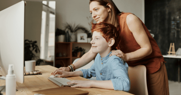 Mum and child playing online
