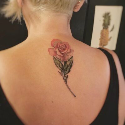 Rose upper back tattoo