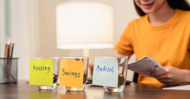 money budget apps woman saving into jars