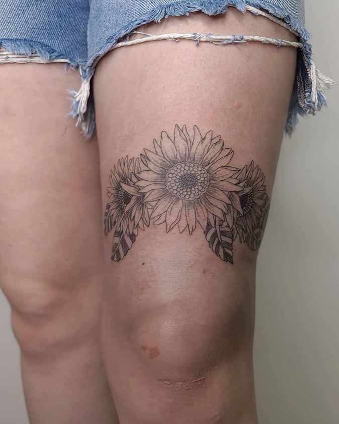 Flower knee tattoo