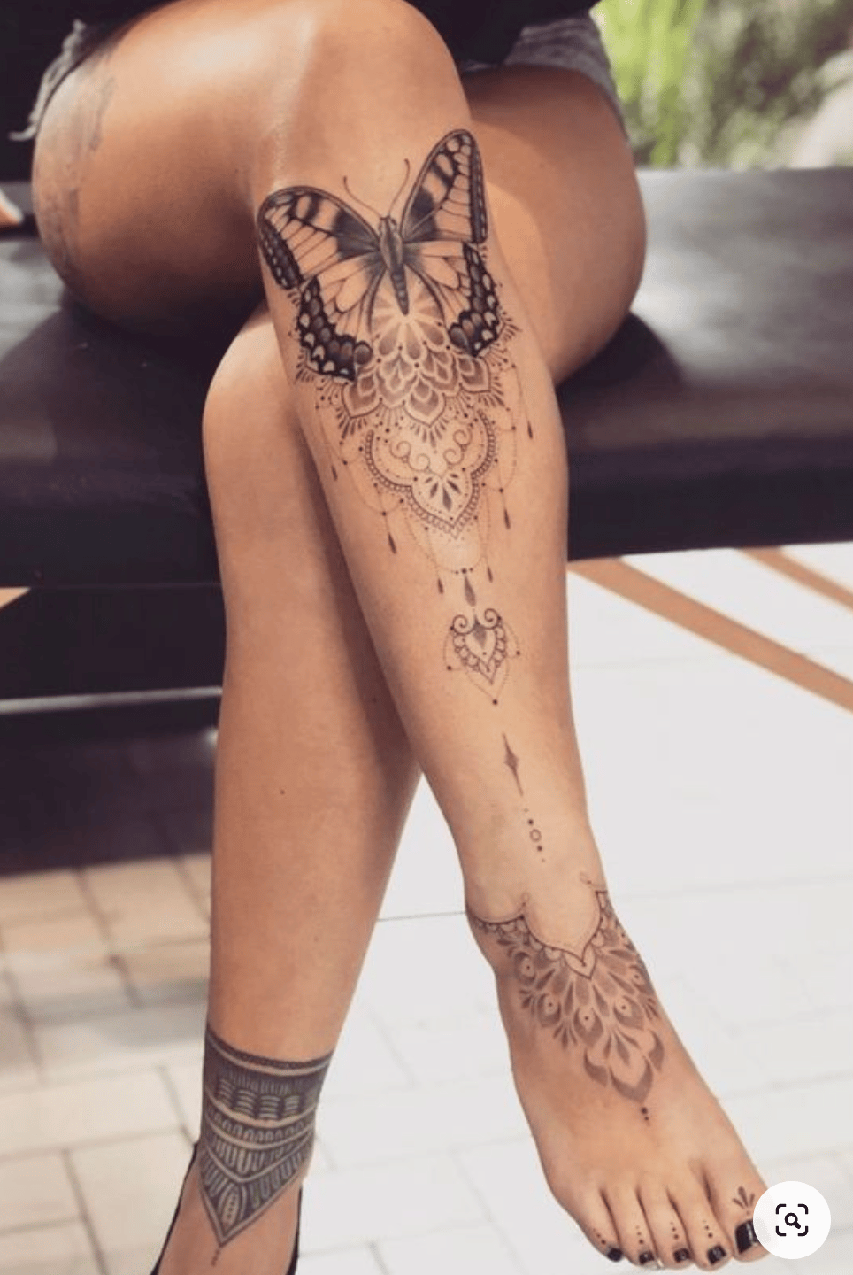 Female native American chief tattoo on the left calf