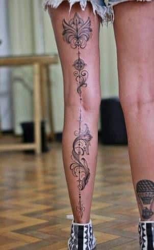 Full back of leg tattoo