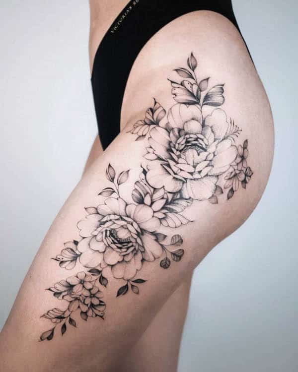 Rose upper thigh tattoo