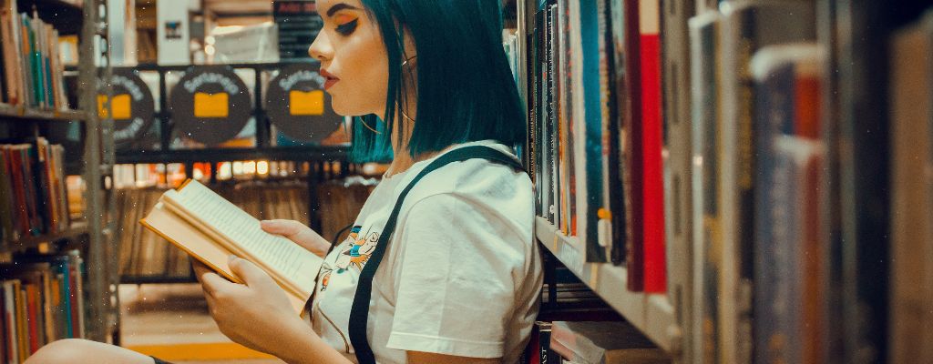 mama reading in a warm inviting library